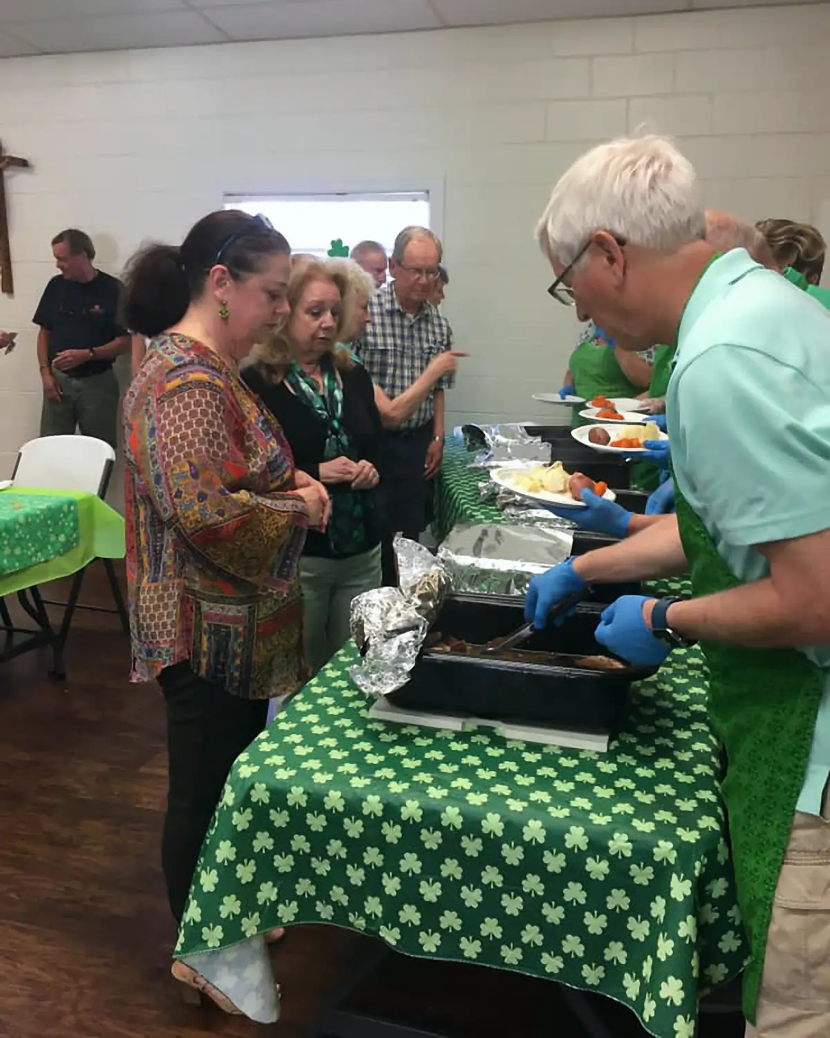 Volunteers Mel & Mike serving dinner at St. Patrick's Day Event