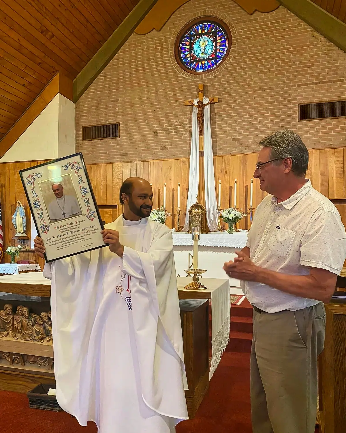 Fr. Mathew presented with the Papal Blessing from the parish by Reed Carpenter