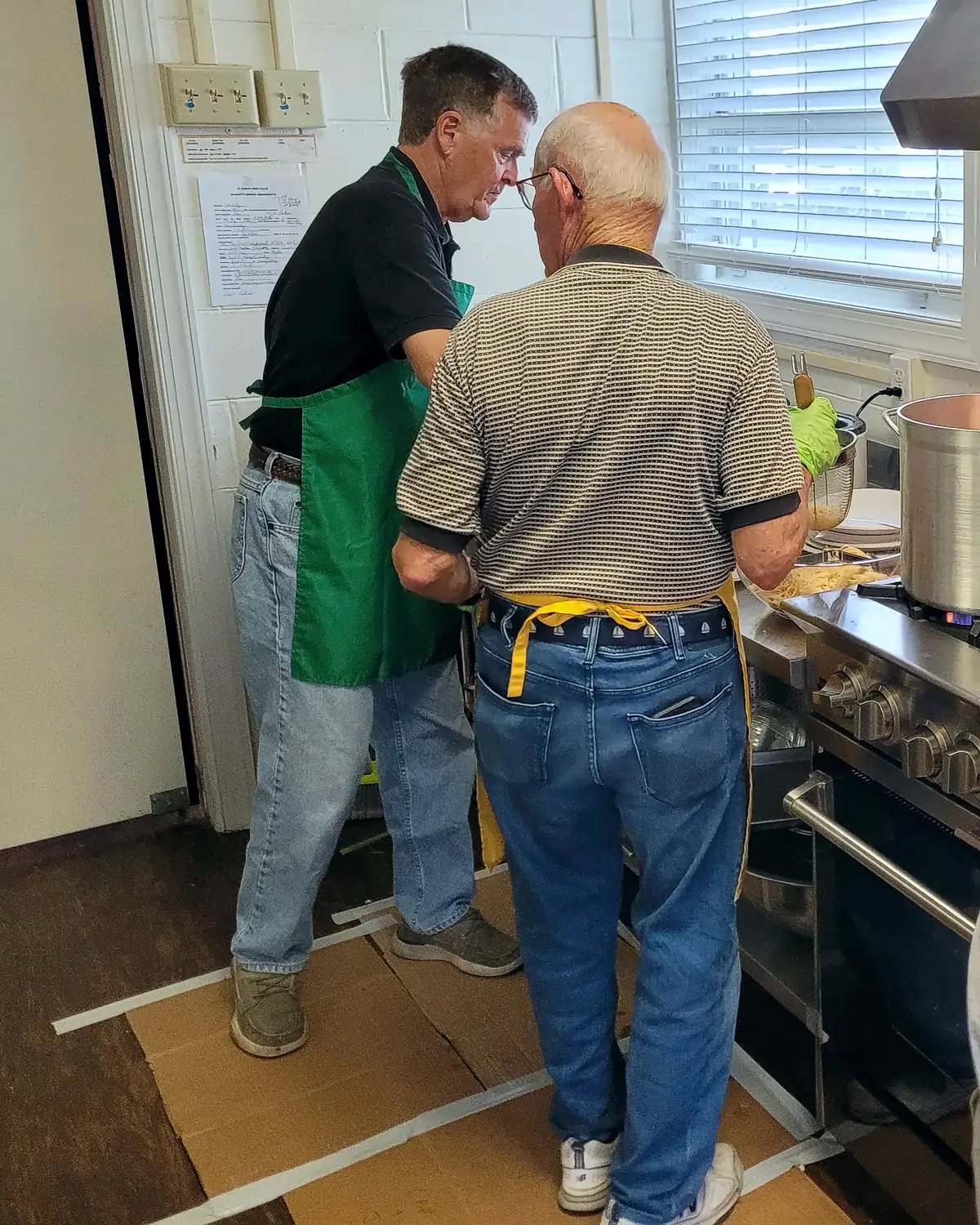 Men's Club volunteers serving up spaghetti